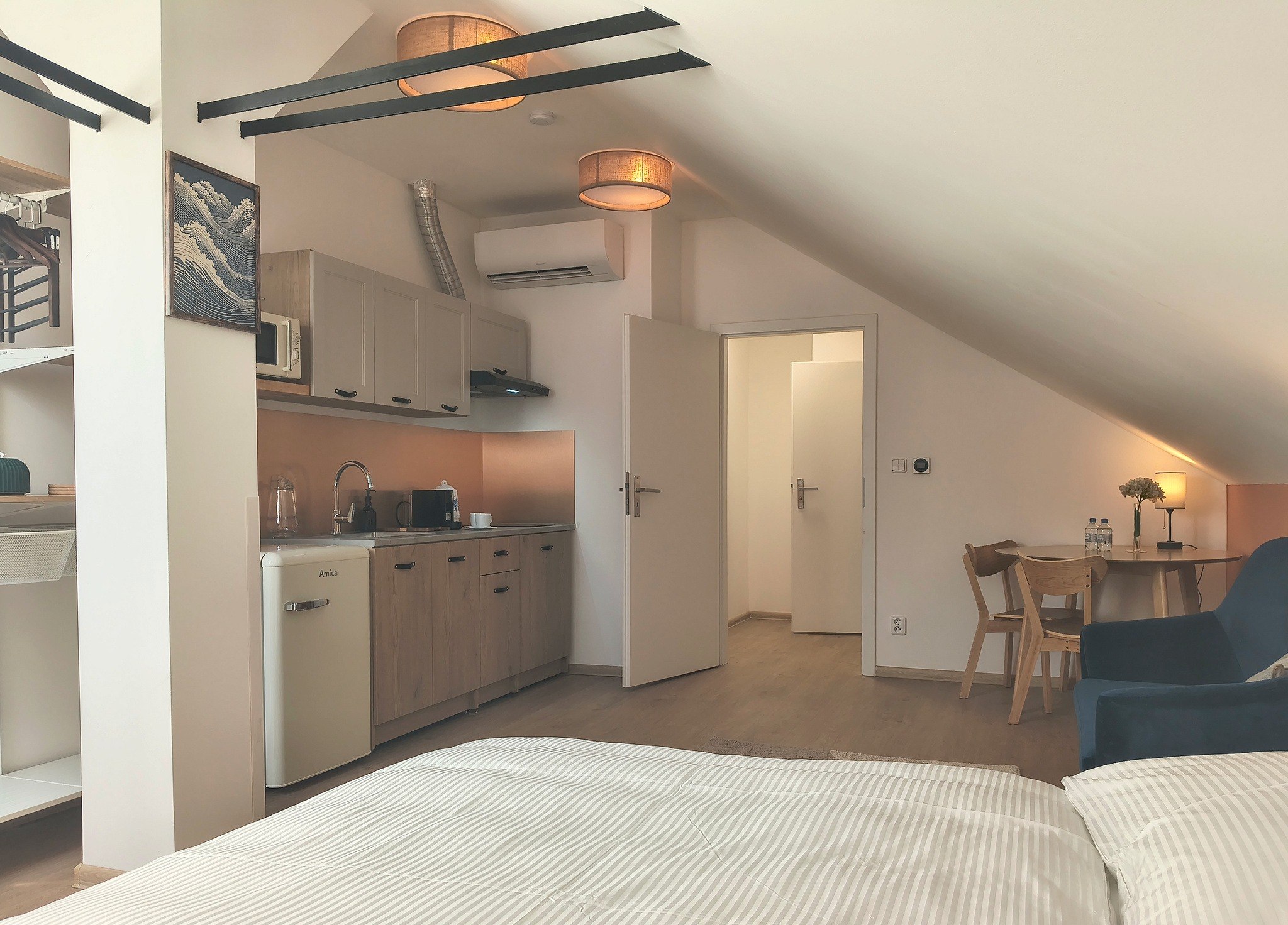 View across room 401 towards the kitchenette and dining table